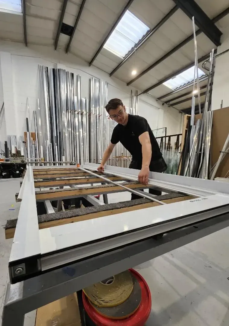 Aluminium door frame being checked before dispatch
